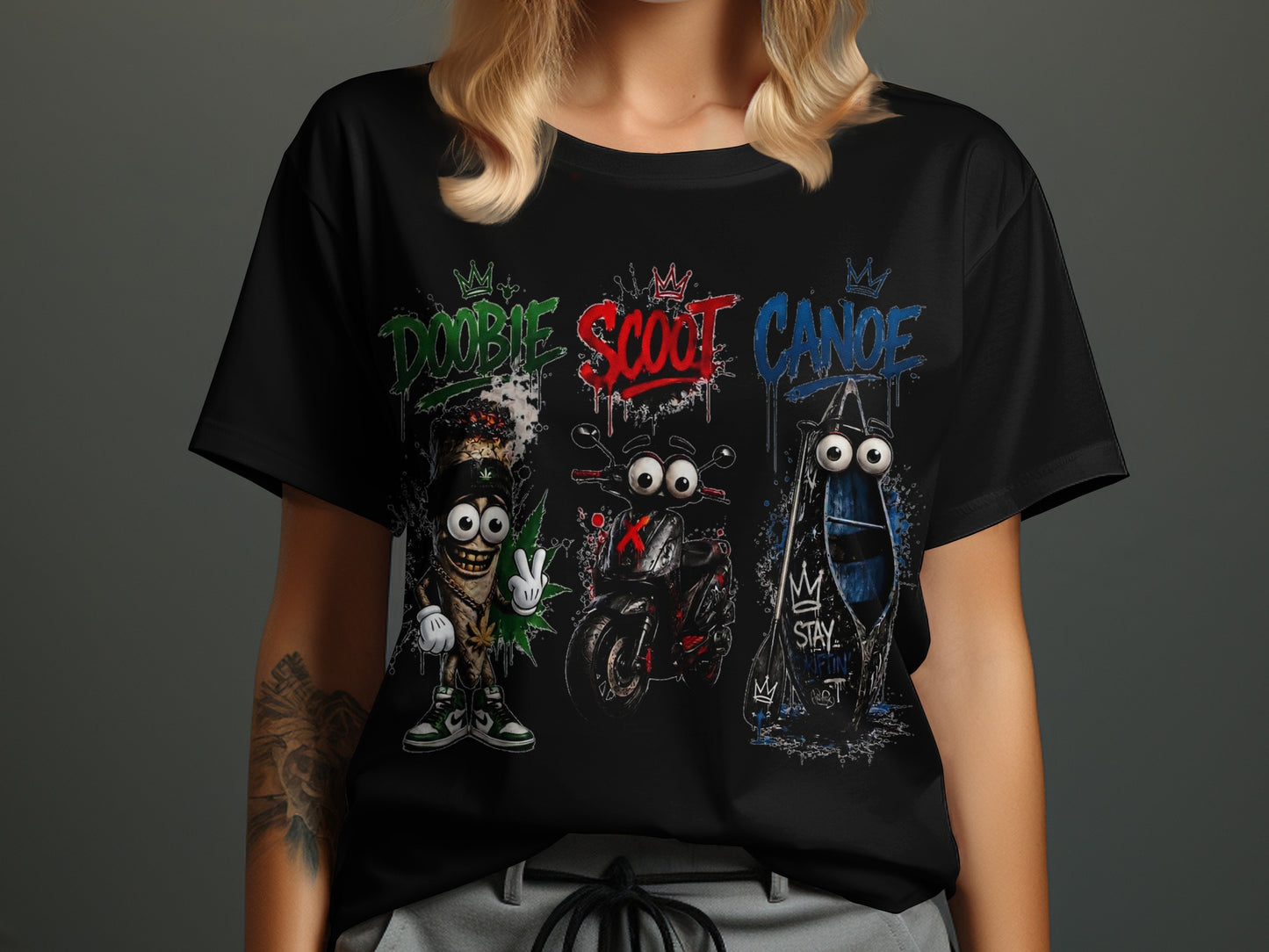 Black t-shirt with cartoon characters: a joint, motorcycle, and canoe with text "Doobie," "Scoot," and "Canoe."