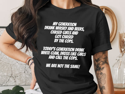 Black t-shirt with white text comparing past and present generations' behaviors.