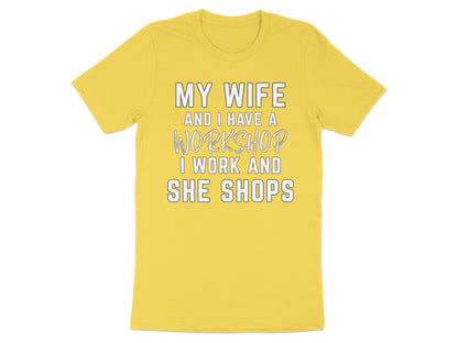 Yellow t-shirt with text "MY WIFE AND I HAVE A WORKSHOP I WORK AND SHE SHOPS".