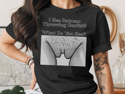 Black t-shirt with text "I See Batman Throwing Confetti What Do You See?" and a drawing.