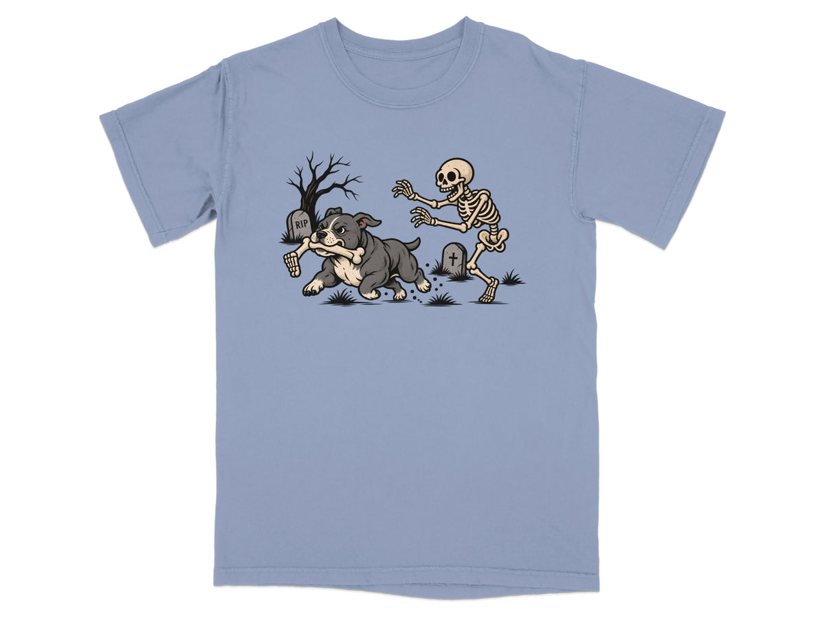 A dog runs with a bone while a skeleton chases it in a graveyard.