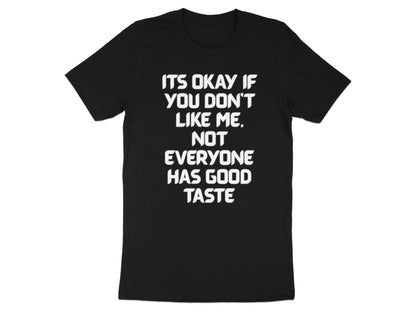 Black t-shirt with white text: "It's okay if you don't like me. Not everyone has good taste."
