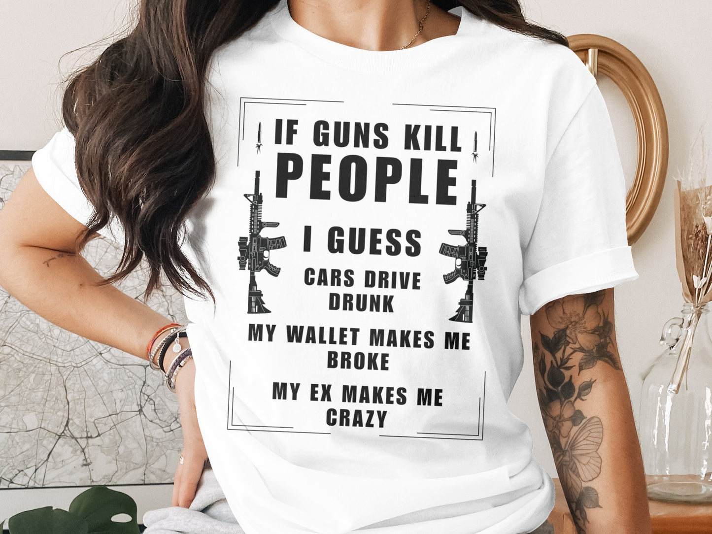 White t-shirt with "If Guns Kill People, I Guess Cars Drive Drunk" text.