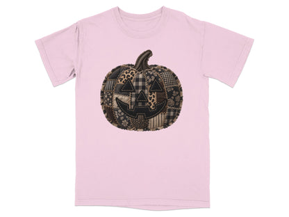 Pink t-shirt with a patchwork pumpkin graphic.