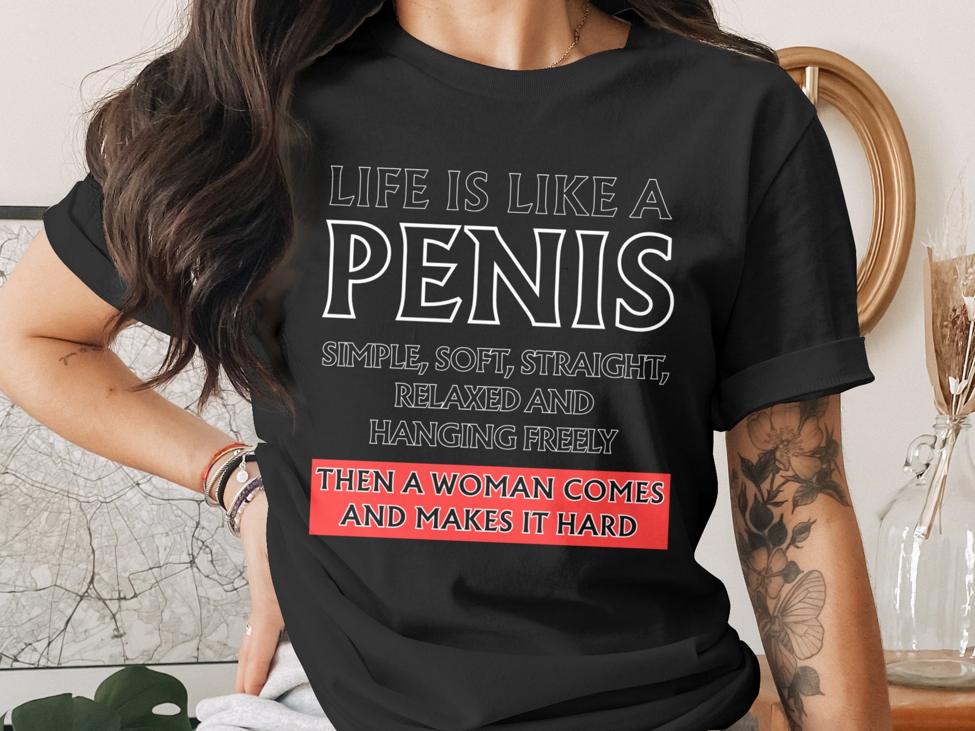 Black t-shirt with white text: "Life is like a penis. Simple, soft, straight, relaxed and hanging freely. Then a woman comes and makes it hard."