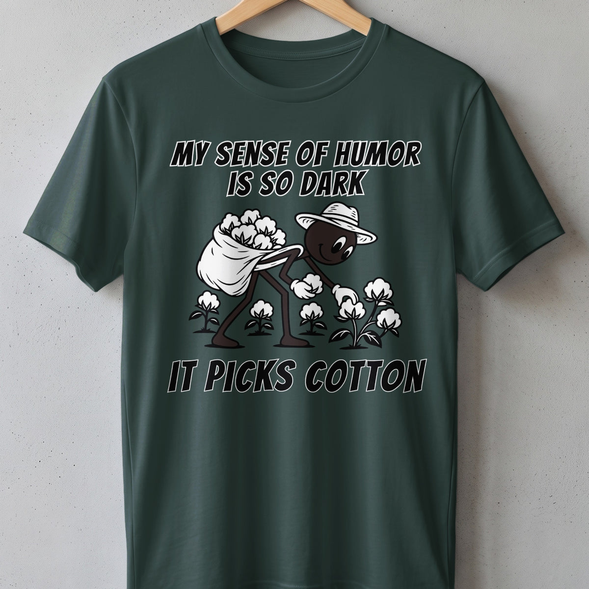 Dark humor t-shirt with illustration of person picking cotton and text "MY SENSE OF HUMOR IS SO DARK IT PICKS COTTON".