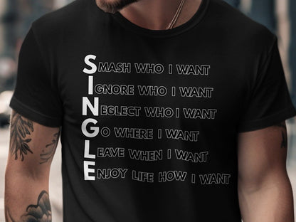 Black t-shirt with white text spelling "SINGLE" vertically, each letter followed by a phrase.
