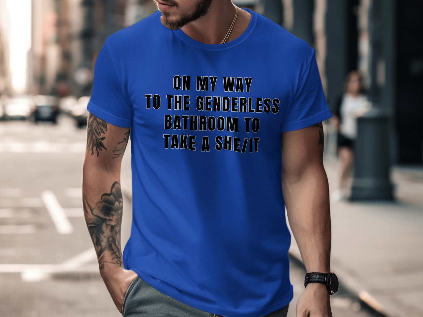Blue t-shirt with text "ON MY WAY TO THE GENDERLESS BATHROOM TO TAKE A SHE/IT".
