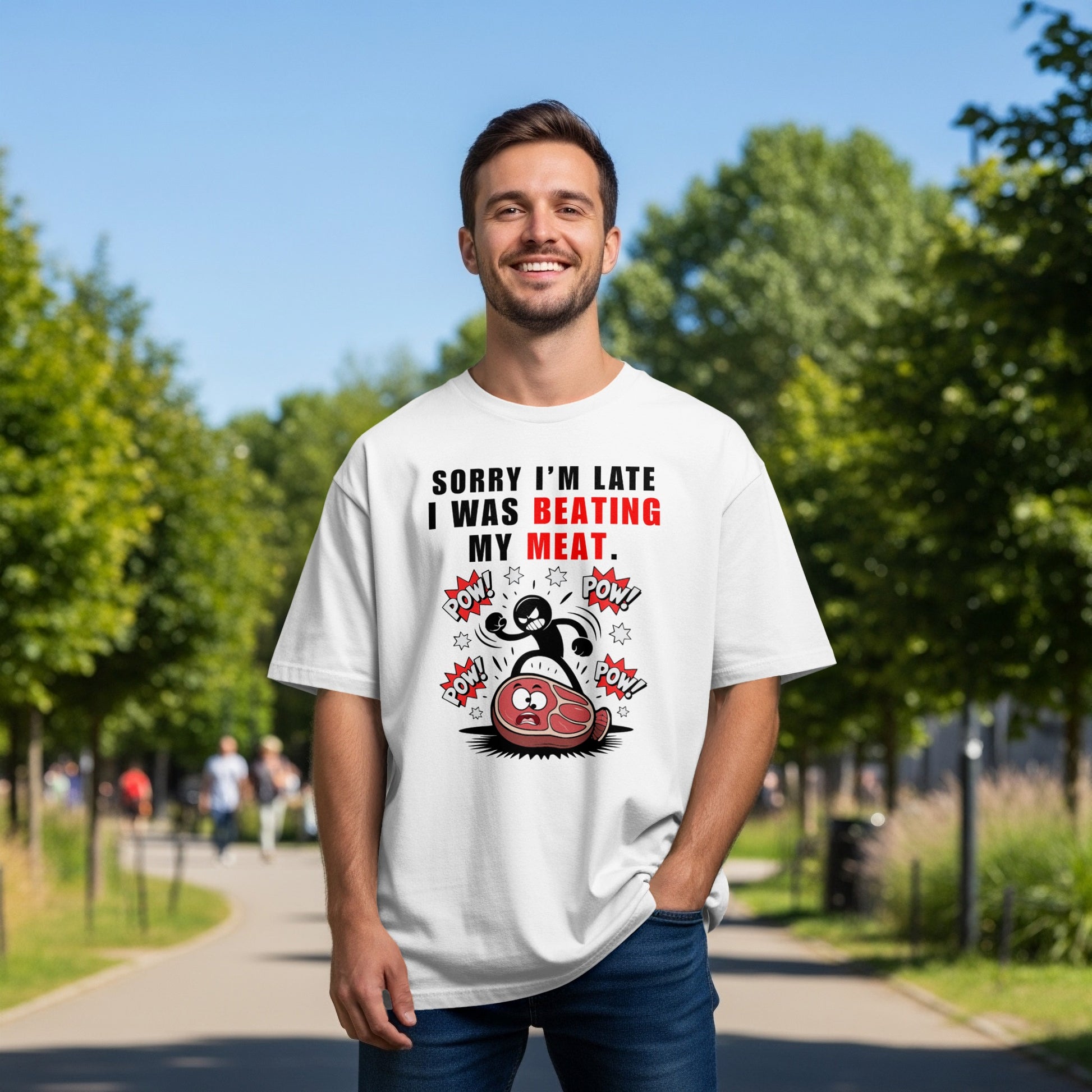 White t-shirt with graphic text saying "Sorry I'm late I was beating my meat" and cartoon steak.