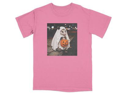 Opossum in ghost costume holding jack-o'-lantern candy bucket on a street.