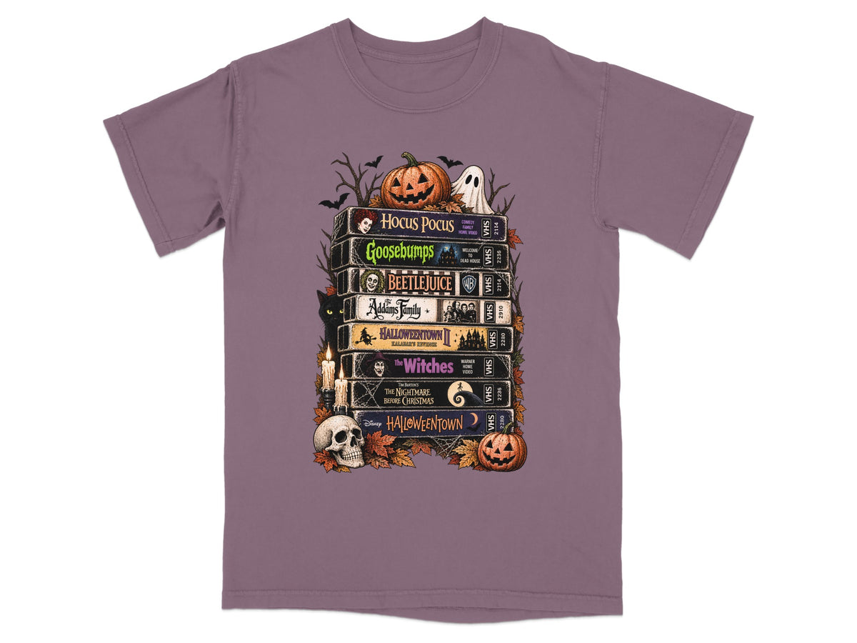 Halloween movie VHS stack with Hocus Pocus, Goosebumps, Beetlejuice, Addams Family, and more.