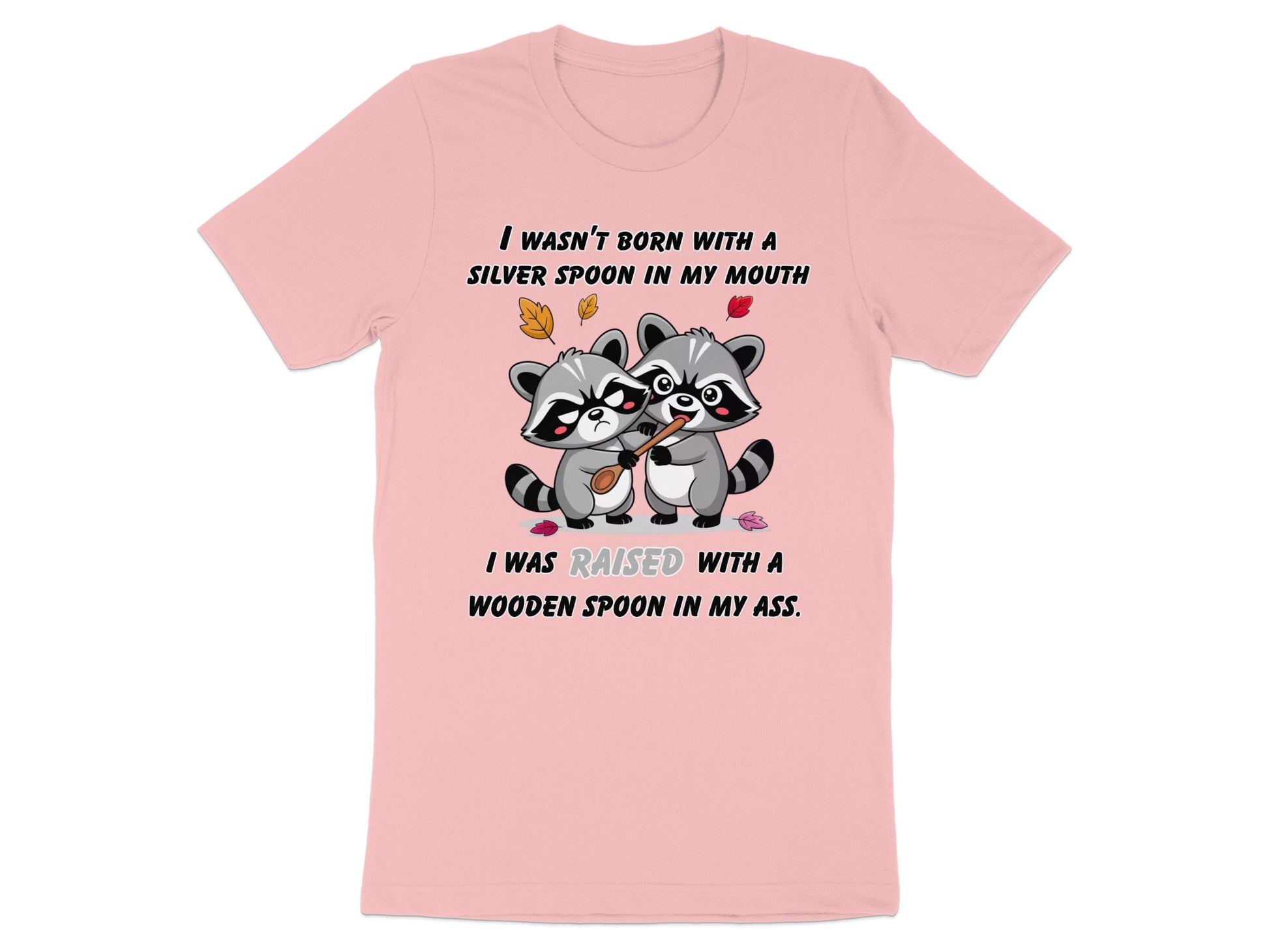Pink t-shirt with raccoons holding a wooden spoon and humorous text about upbringing.