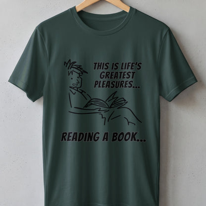 Dark green t-shirt with black line drawing of a person reading and text "This is life's greatest pleasures... reading a book...".