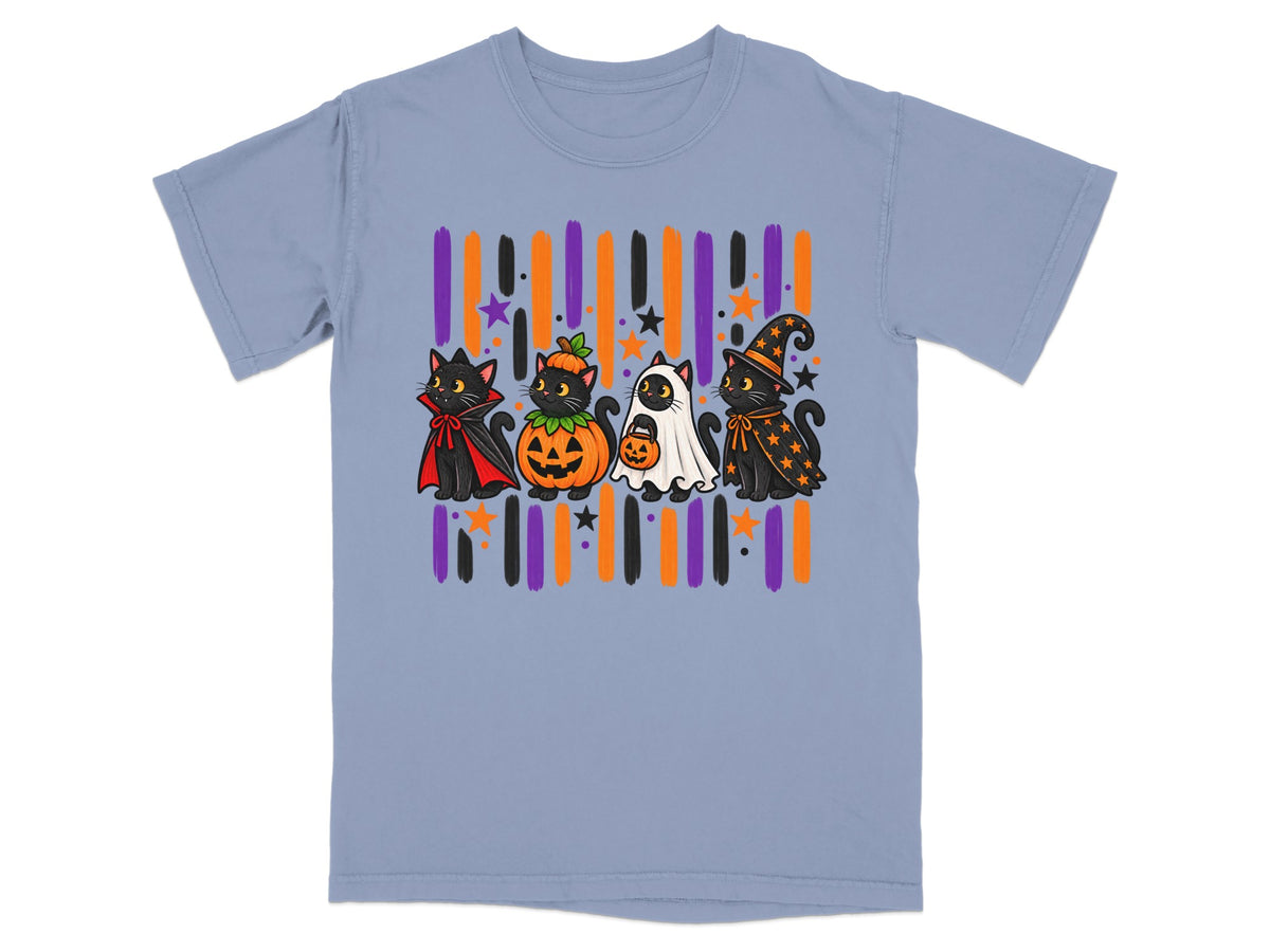 Four black cats in Halloween costumes stand in front of colorful stripes and stars.
