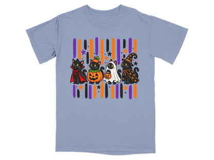 Four black cats in Halloween costumes stand in front of colorful stripes and stars.
