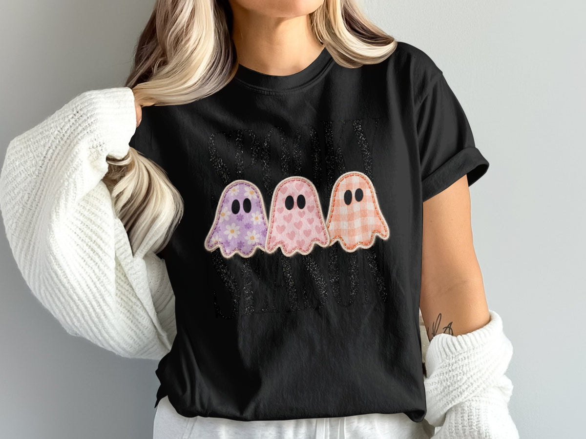 Black t-shirt with three pastel ghosts and "Spooky" text.