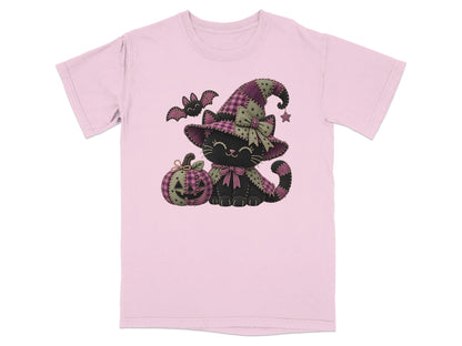 Pink t-shirt with a black cat wearing a witch hat, a pumpkin, and a bat.