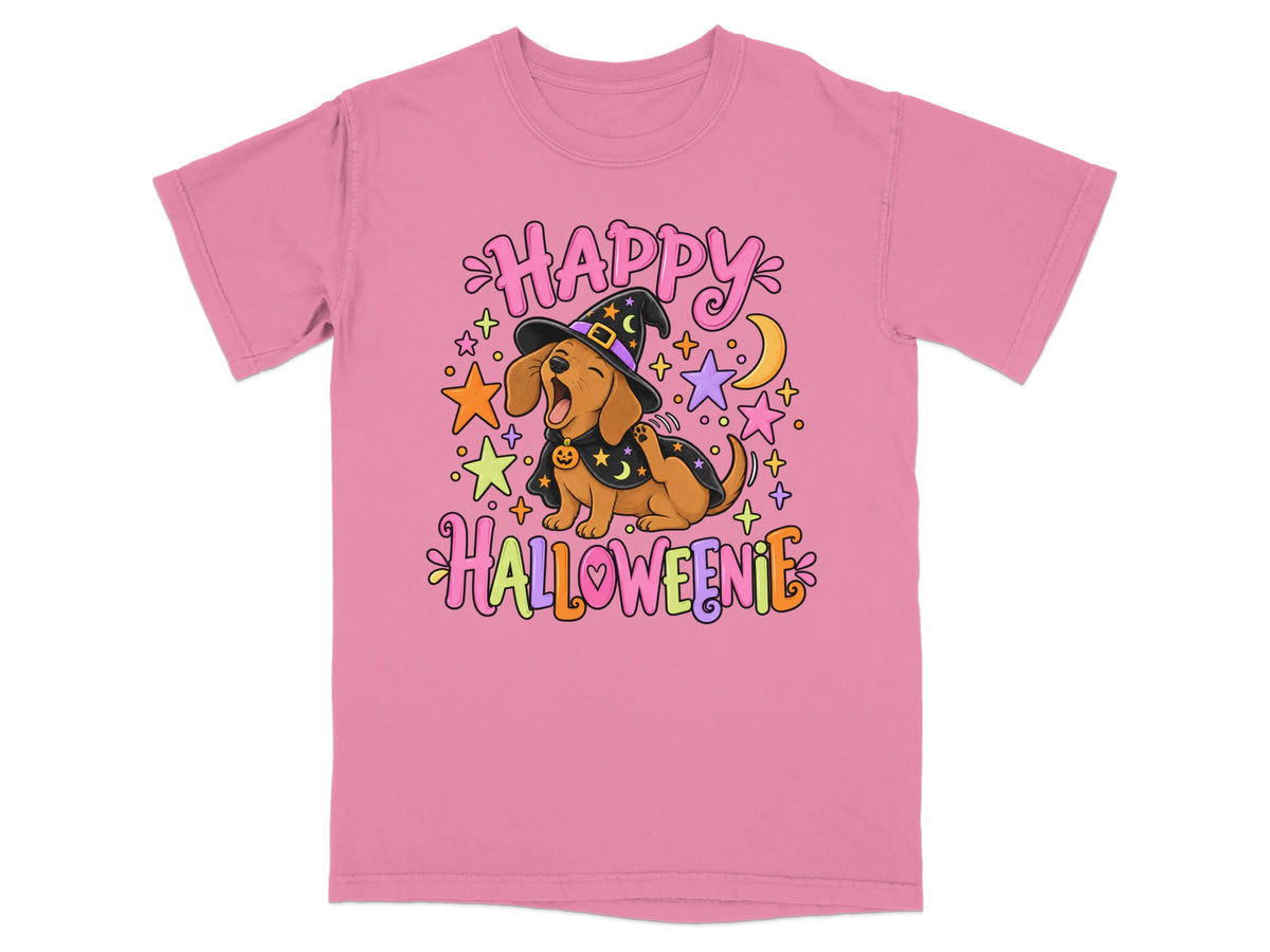 Pink t-shirt with dachshund in witch hat saying "Happy Halloweenie" surrounded by stars and moon.