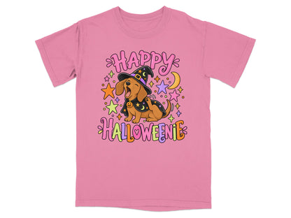 Pink t-shirt with dachshund in witch hat saying "Happy Halloweenie" surrounded by stars and moon.