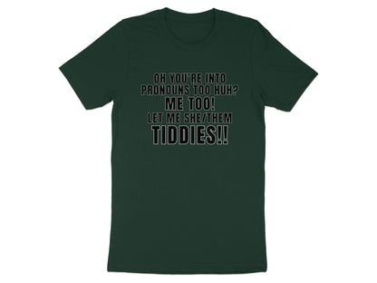 Dark green t-shirt with "Oh you're into pronouns too huh? Me too! Let me she/them tiddies!!" text.
