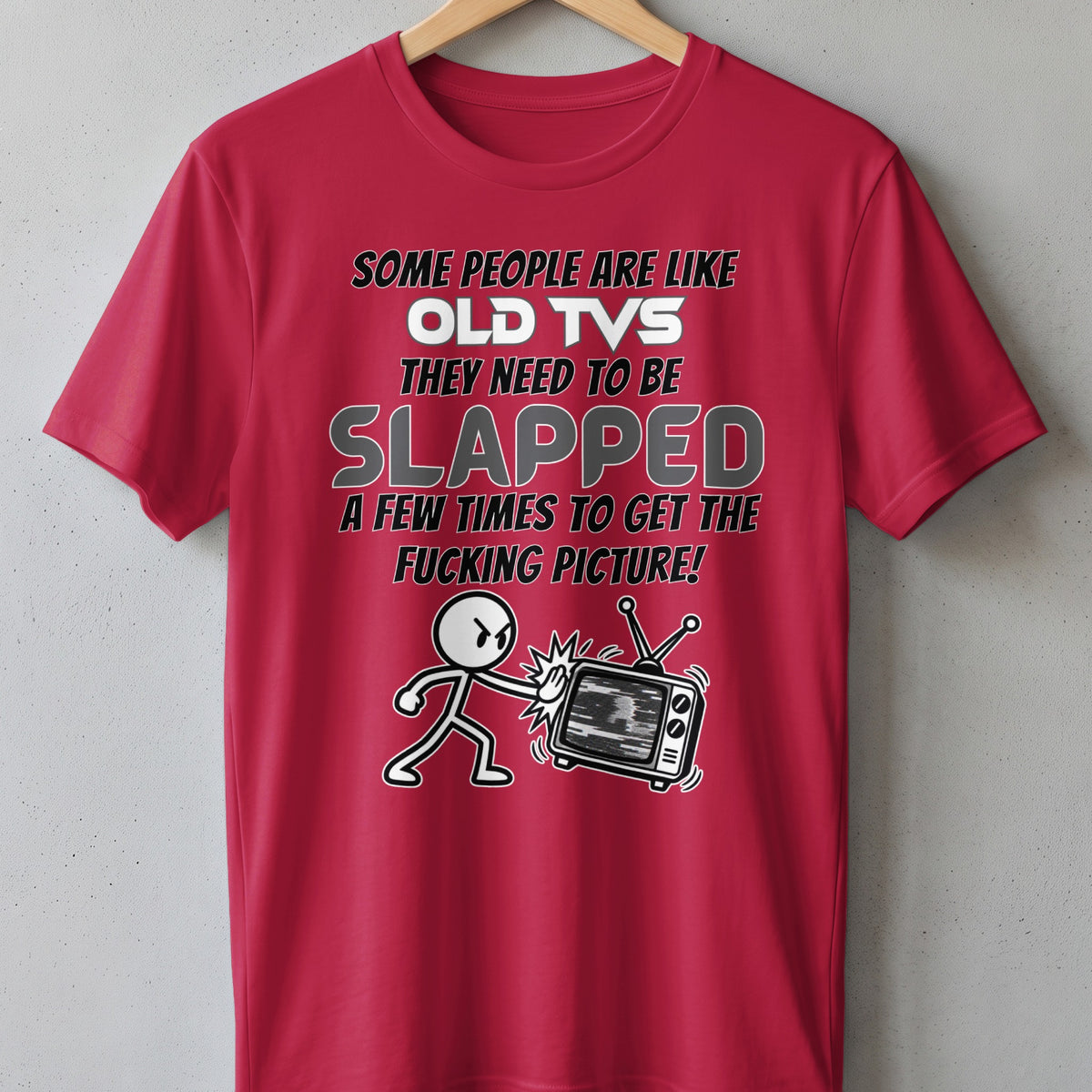Red t-shirt with text and a cartoon figure slapping an old TV.