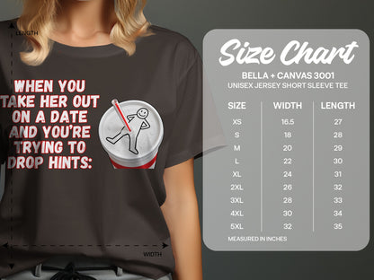 T-shirt with text and graphic of person in soda cup, with size chart.