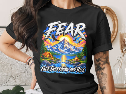 Black t-shirt with graphic "FEAR FACE EVERYTHING AND RISE" and mountain camping scene.