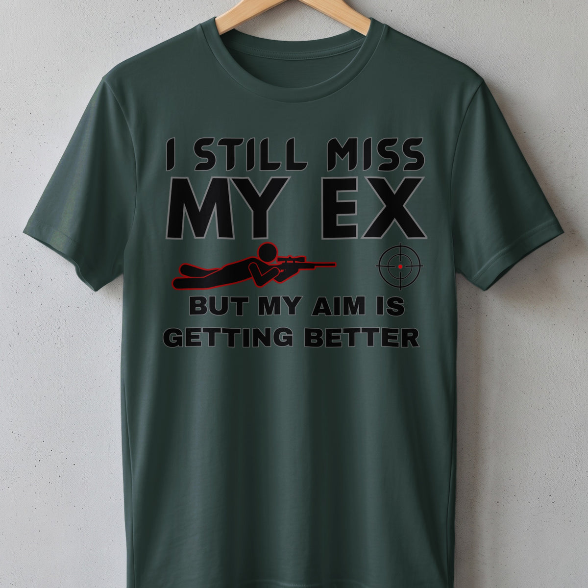 Green t-shirt with text "I still miss my ex but my aim is getting better."