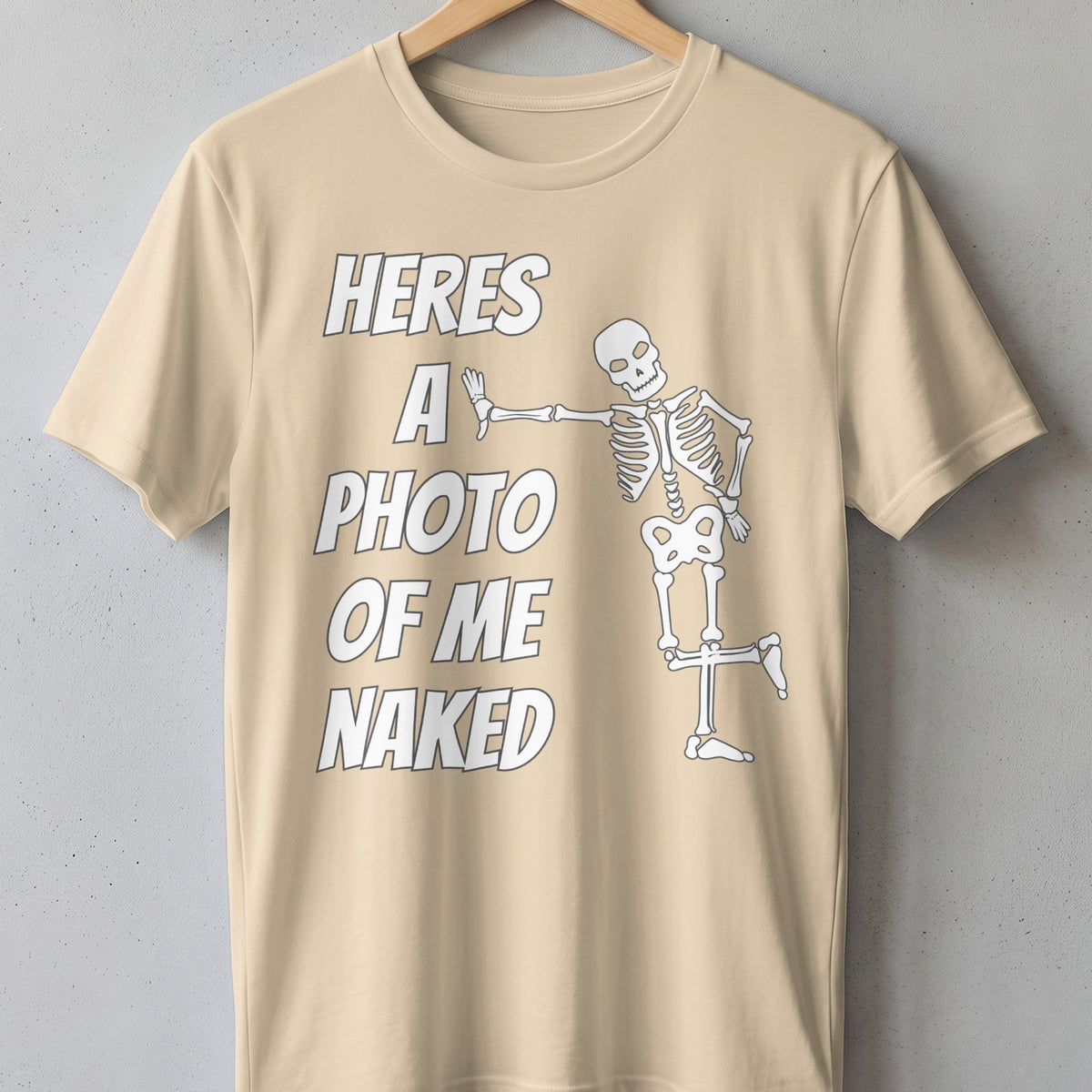 T-shirt with text "heres a photo of me naked" and a skeleton graphic.