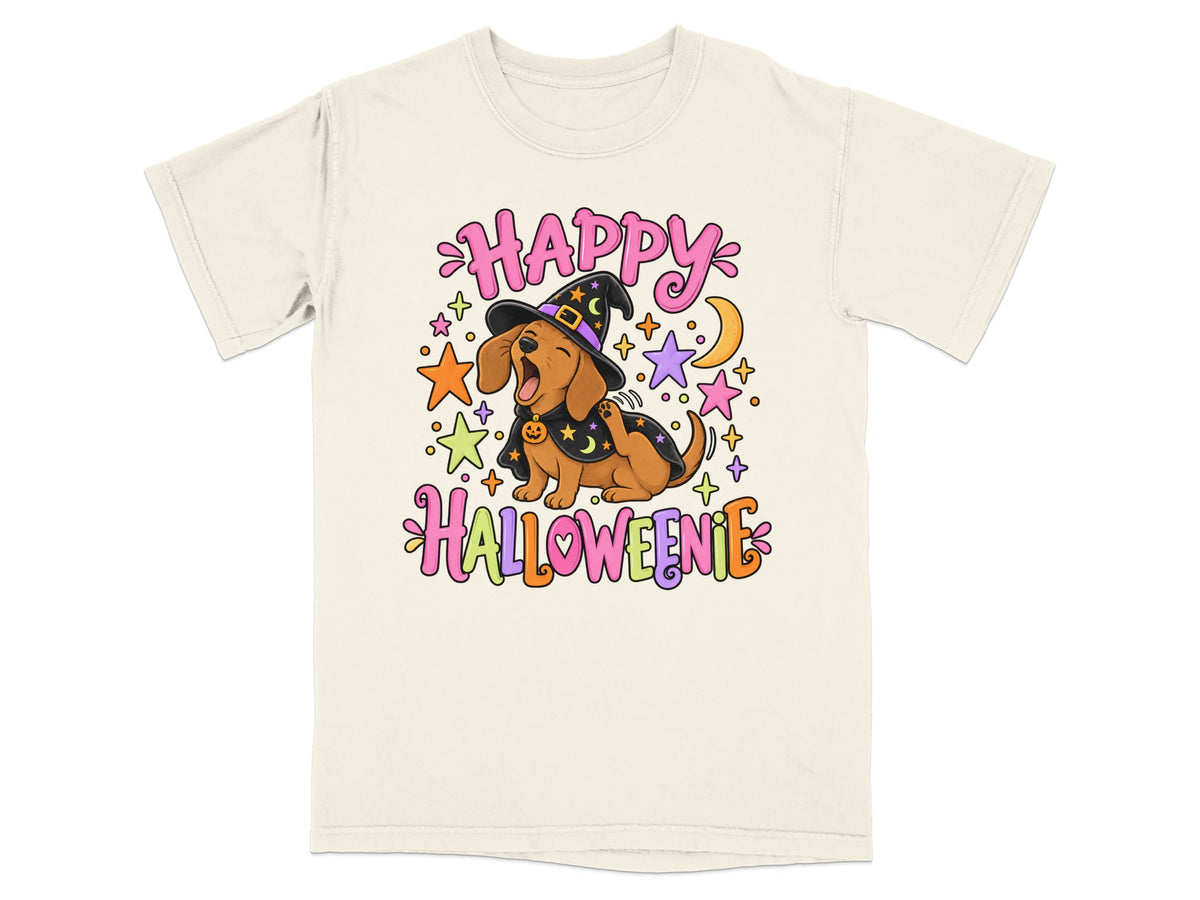 Dachshund wearing witch hat and cape with "Happy Halloweenie" text and stars.