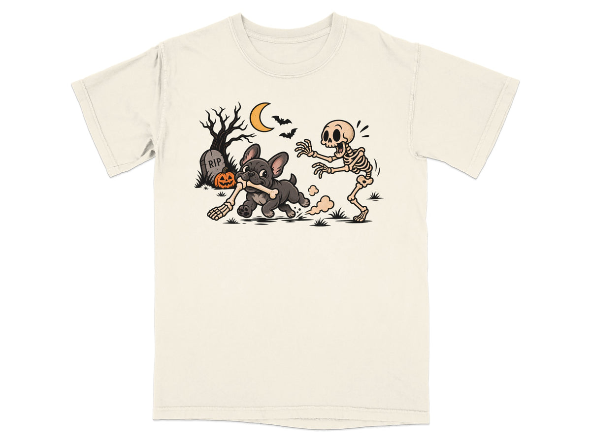 French bulldog runs with bone while skeleton chases under Halloween moon.