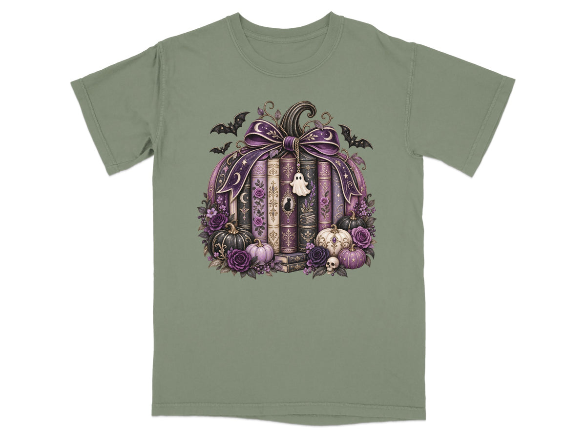 A pumpkin made of books with bats, a ghost, skulls, and purple flowers.