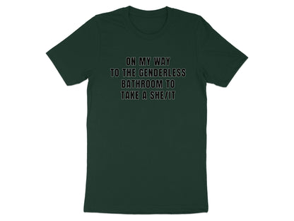 Dark green t-shirt with white text "ON MY WAY TO THE GENDERLESS BATHROOM TO TAKE A SHE/IT".