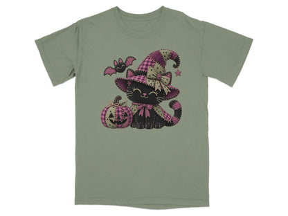 Black cat wearing a witch hat with a pumpkin and bat on a t-shirt.