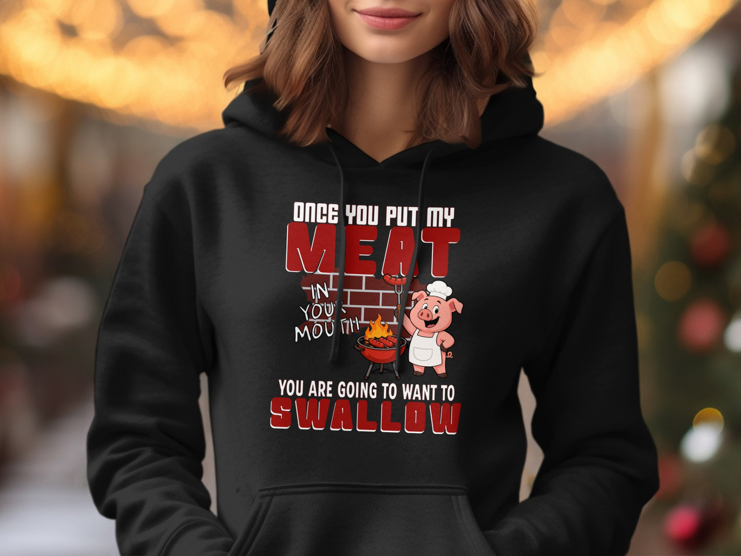 Black hoodie with a cartoon pig chef and text about grilling meat.