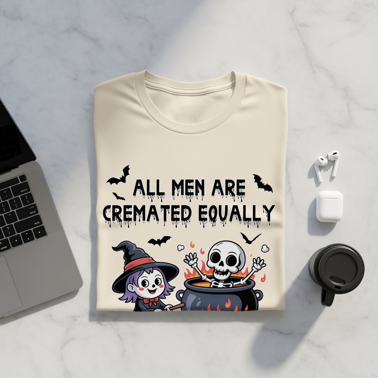 Light-colored t-shirt with black text and cartoon Halloween graphics.