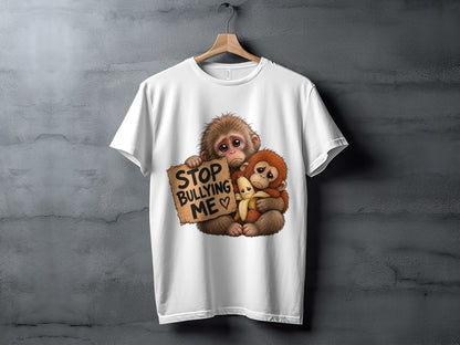 Two sad monkeys embrace, one holding a "Stop Bullying Me" sign and a banana.