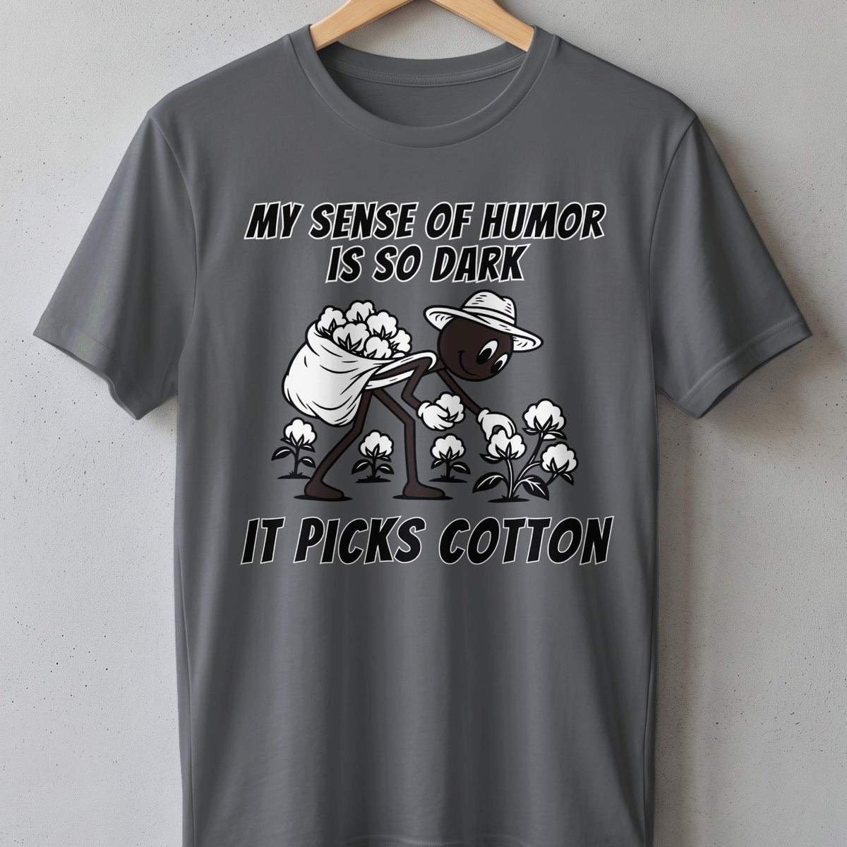 Gray t-shirt with "MY SENSE OF HUMOR IS SO DARK IT PICKS COTTON" text and illustration.