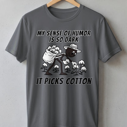 Gray t-shirt with "MY SENSE OF HUMOR IS SO DARK IT PICKS COTTON" text and illustration.