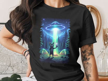 Black t-shirt with a graphic of a cat taking a selfie under an alien UFO beam.