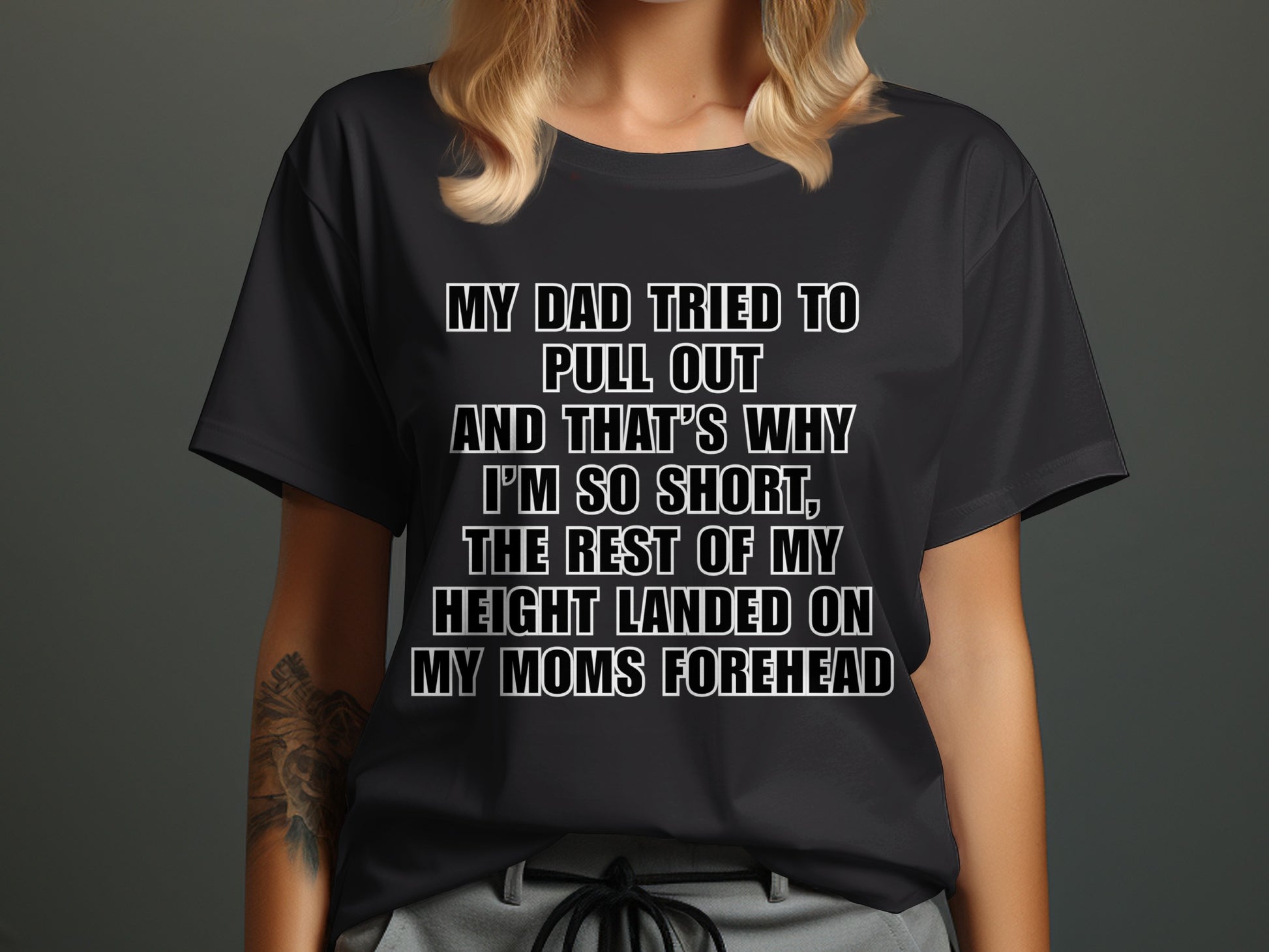 Black t-shirt with text "My dad tried to pull out and that's why I'm so short, the rest of my height landed on my moms forehead."