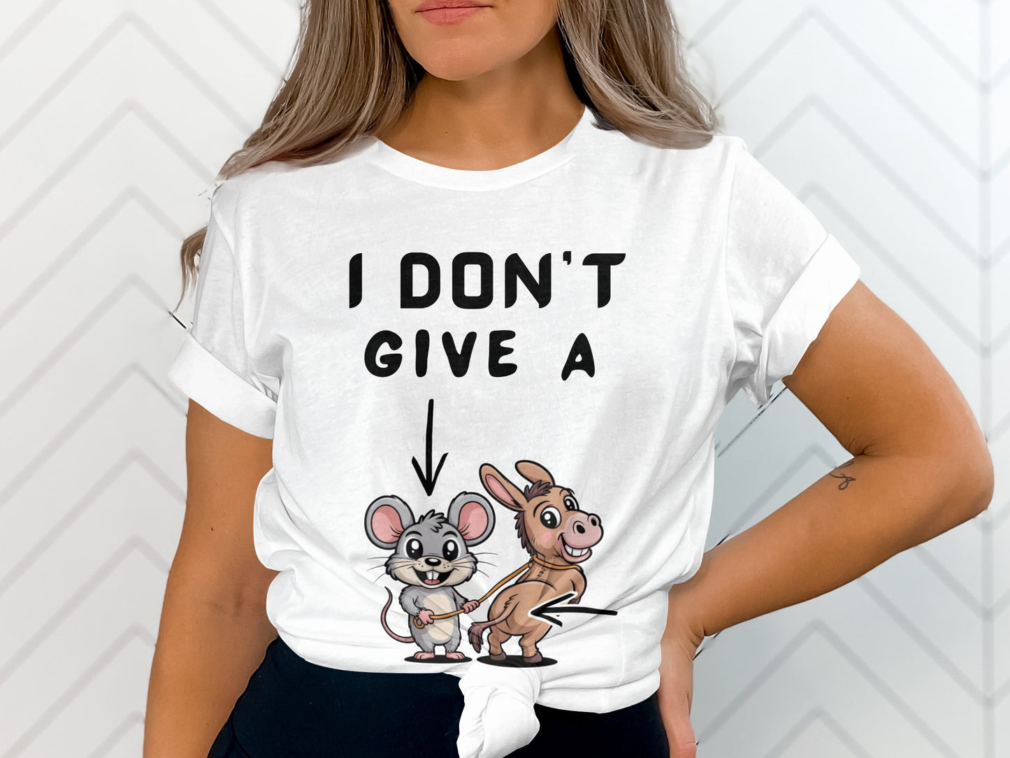 White t-shirt with text and cartoon mouse leading a donkey.