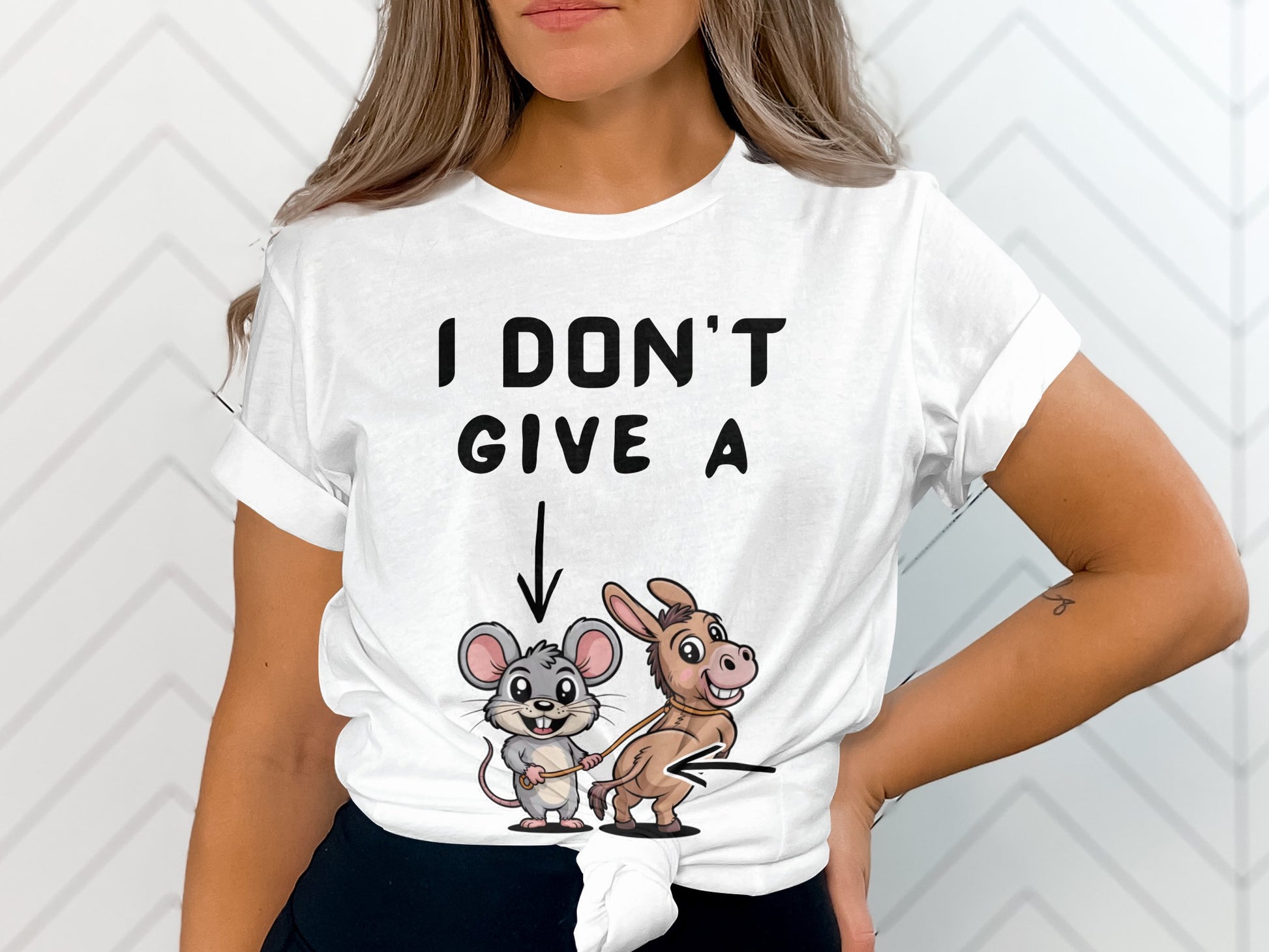 White t-shirt with text and cartoon mouse leading a donkey.