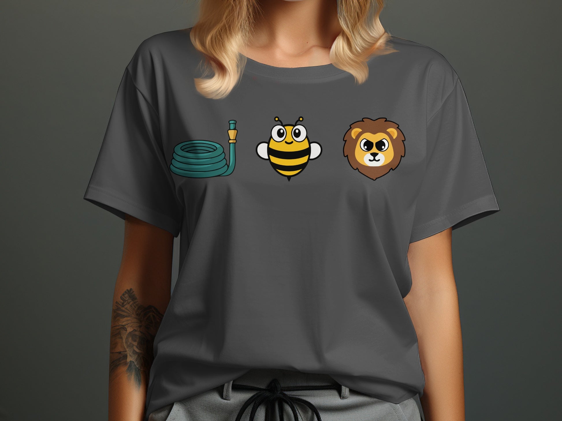 Grey t-shirt with cartoon images of a garden hose, a bee, and a lion's head.