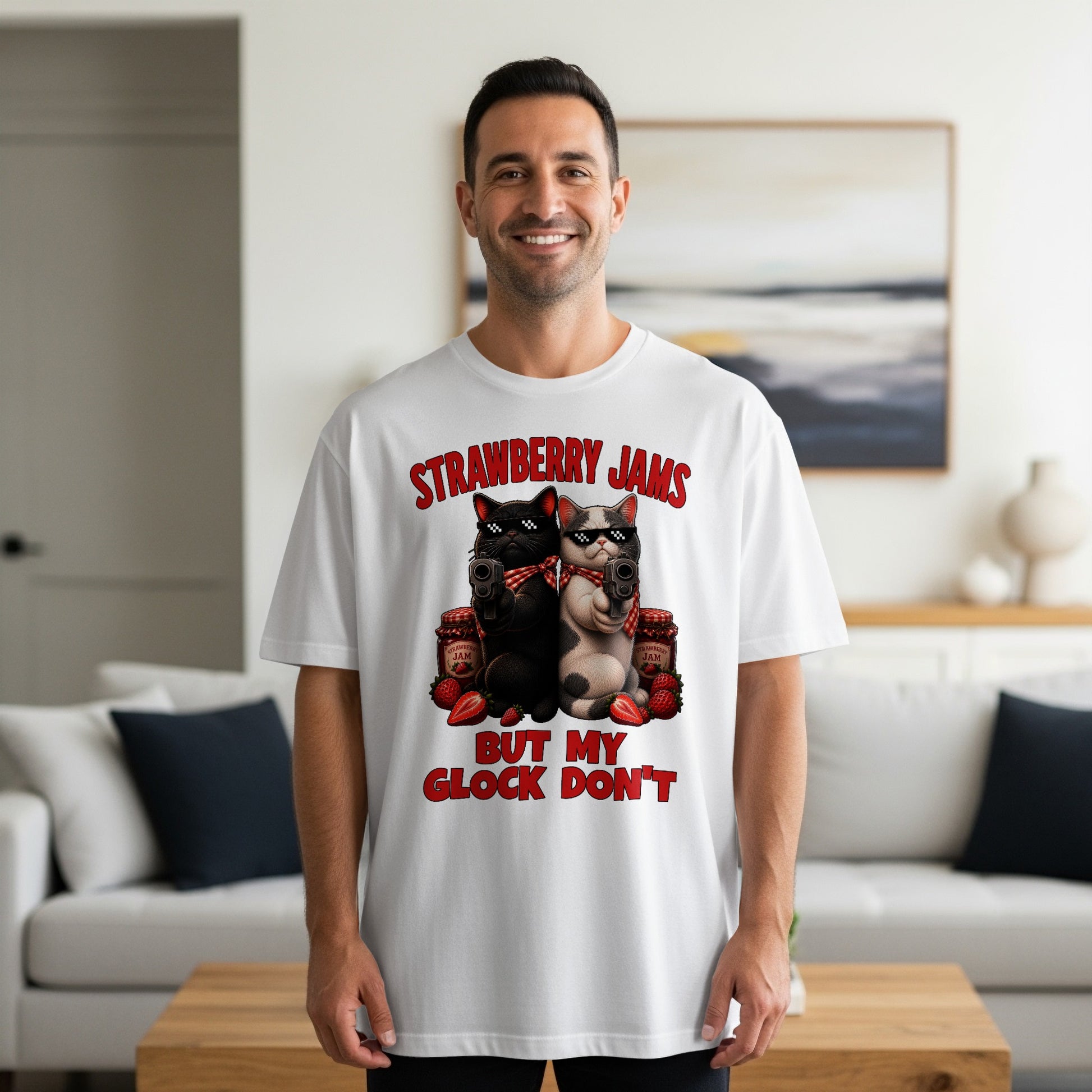 White t-shirt with "Strawberry Jams But My Glock Don't" text and cats with guns.