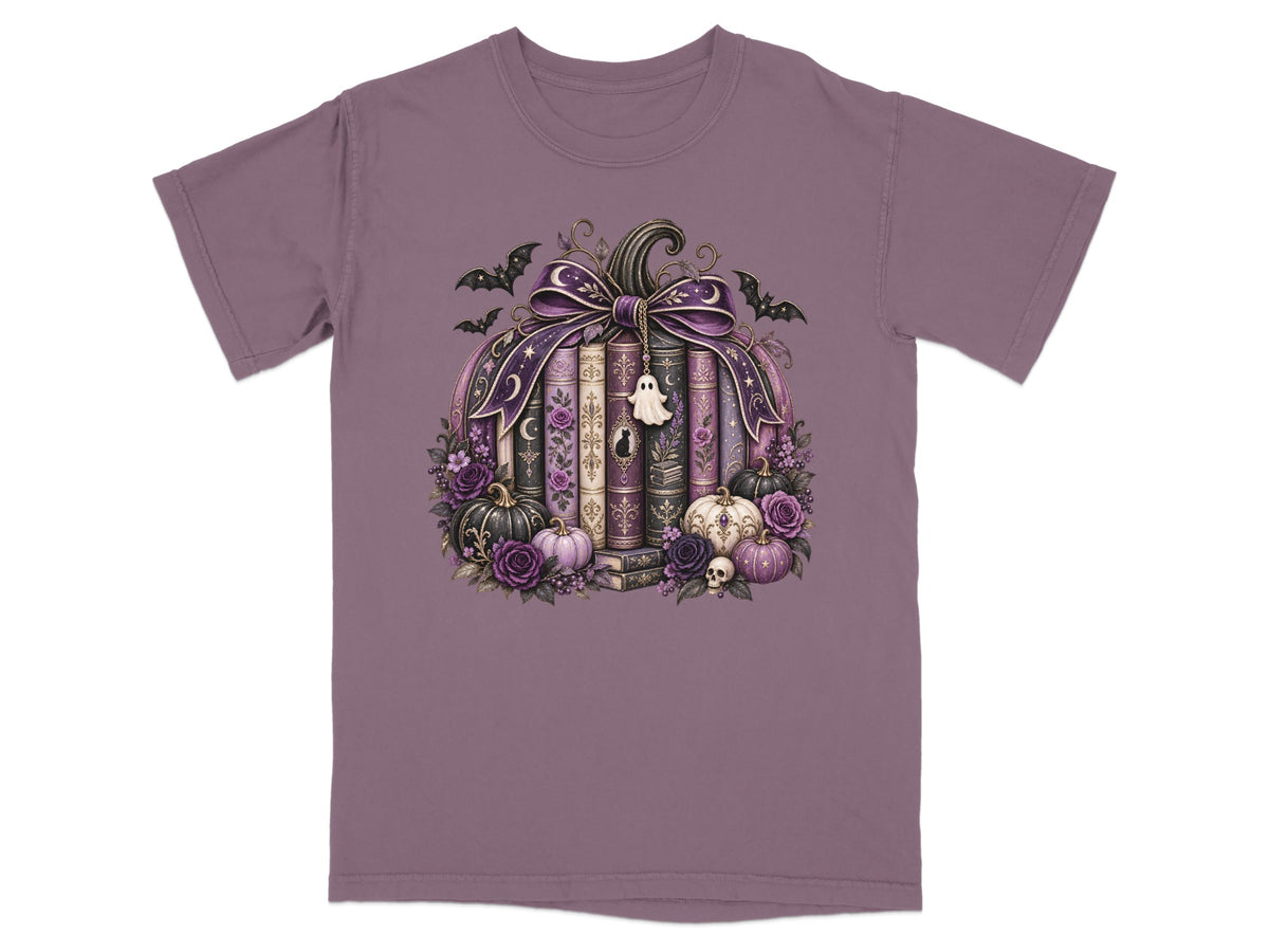 Pumpkin made of books with bats, ghost charm, and gothic floral accents.