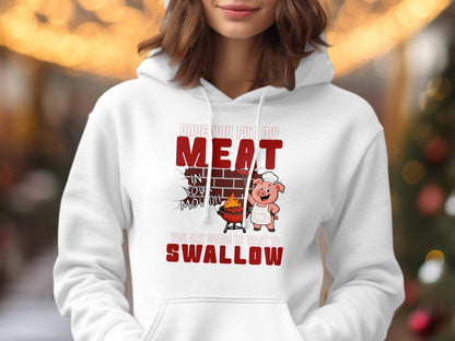 White hoodie with graphic of pig grilling meat and text "Once you put my meat in your mouth you are going to want to swallow".