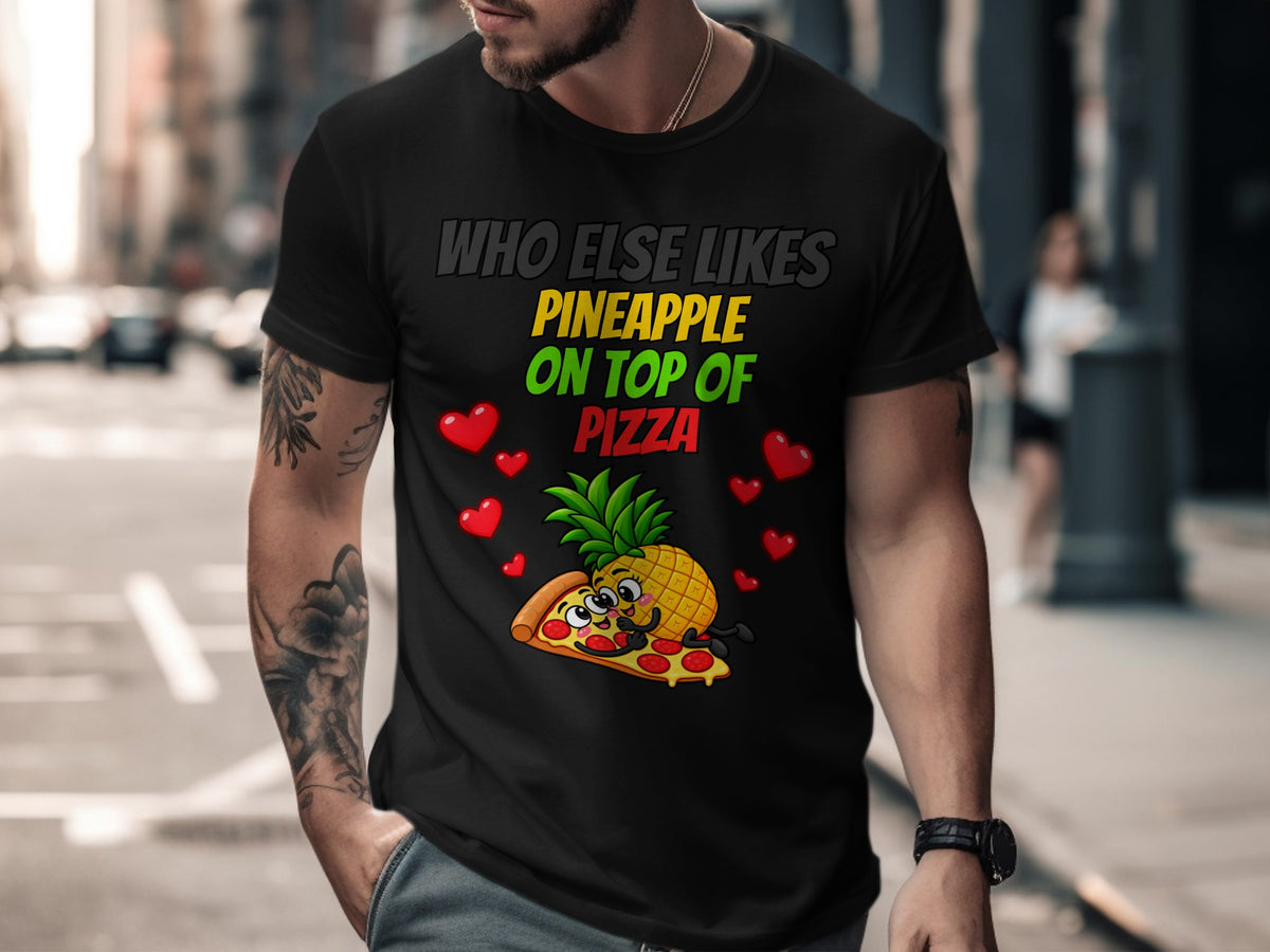 Black t-shirt graphic: "Who else likes pineapple on top of pizza" with cartoon pineapple and pizza.