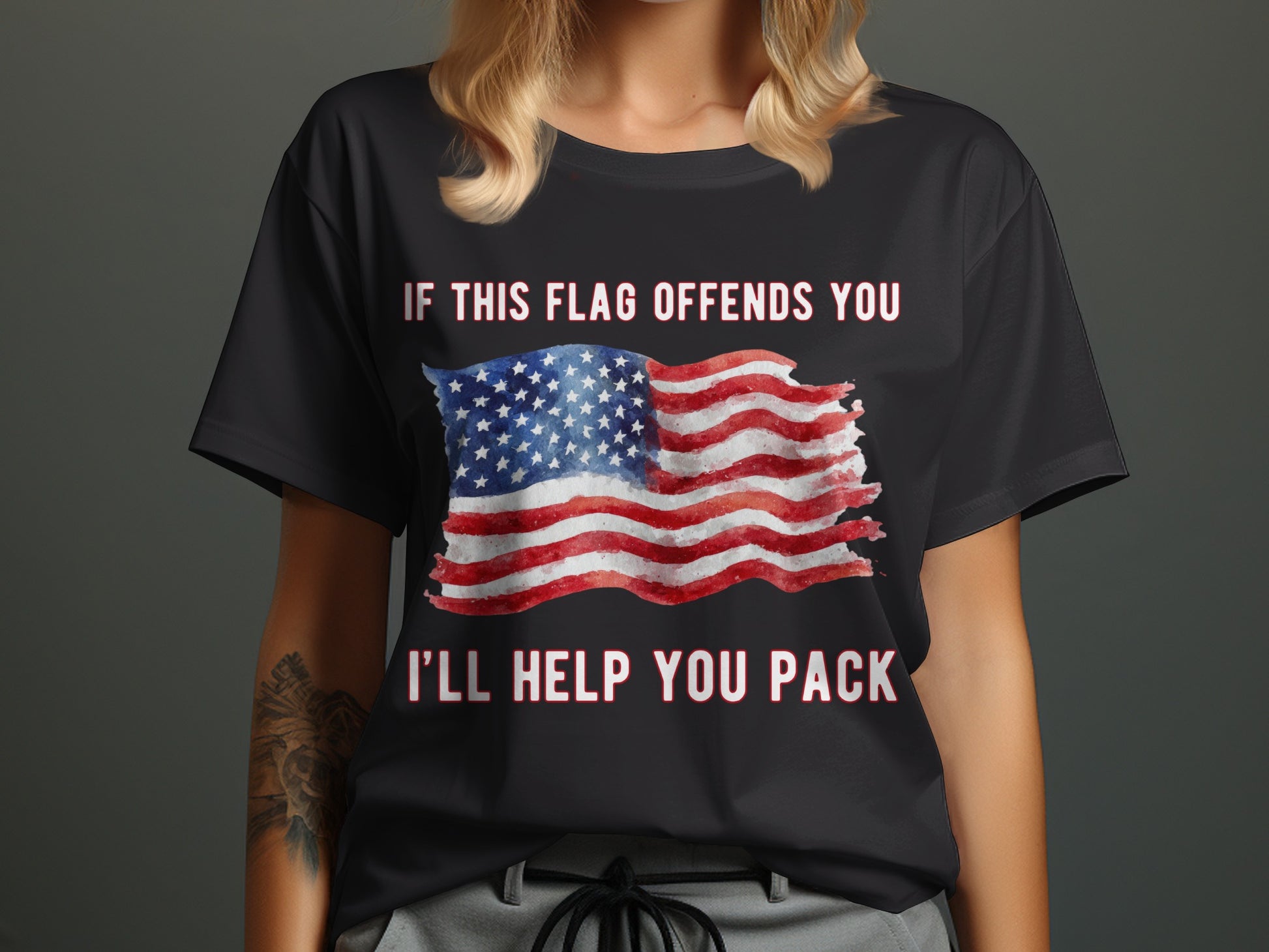 Black t-shirt with American flag and text "IF THIS FLAG OFFENDS YOU I'LL HELP YOU PACK".