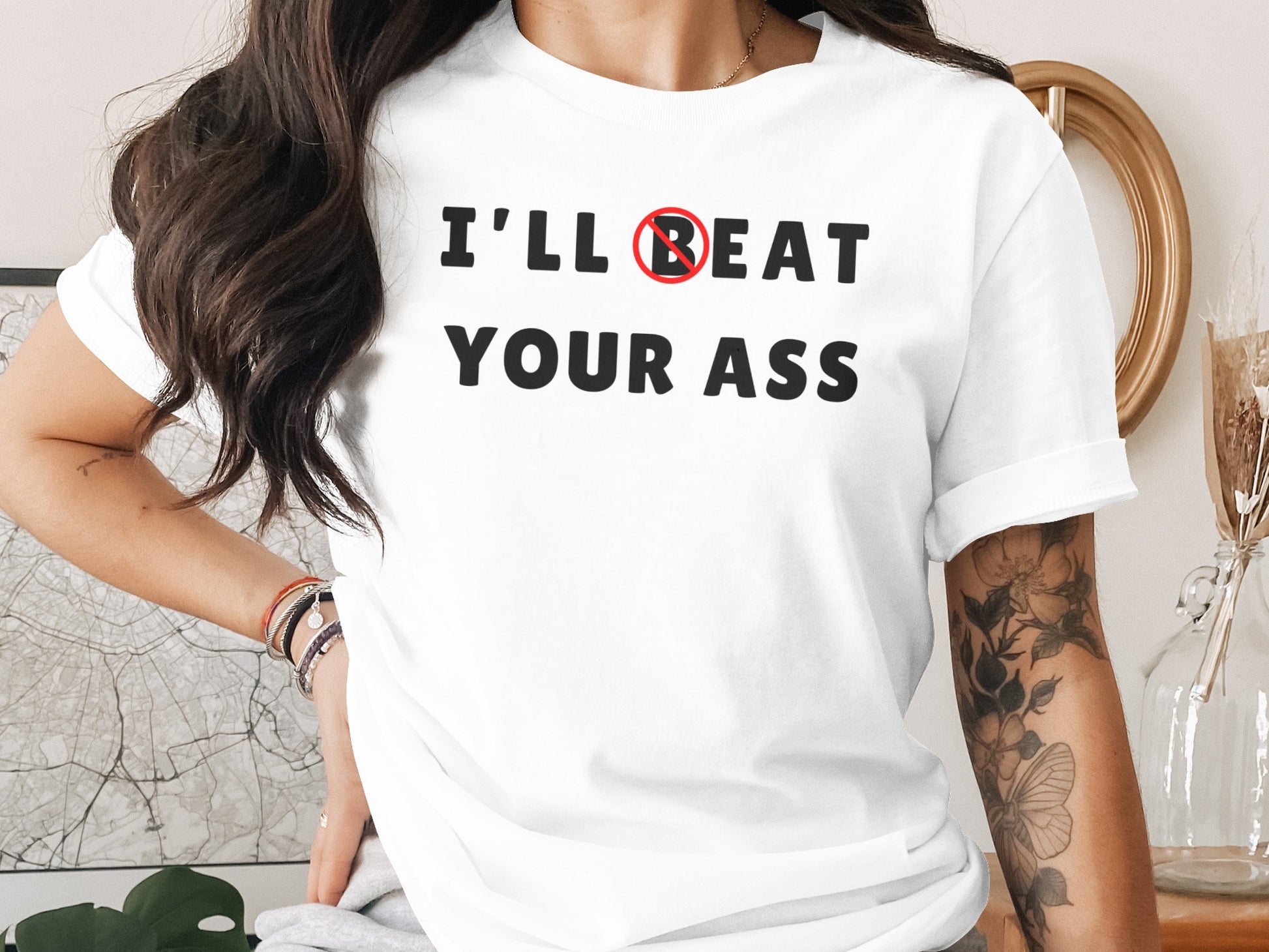 White t-shirt with text "I'll Beat Your Ass" and a red circle with a line through the B.